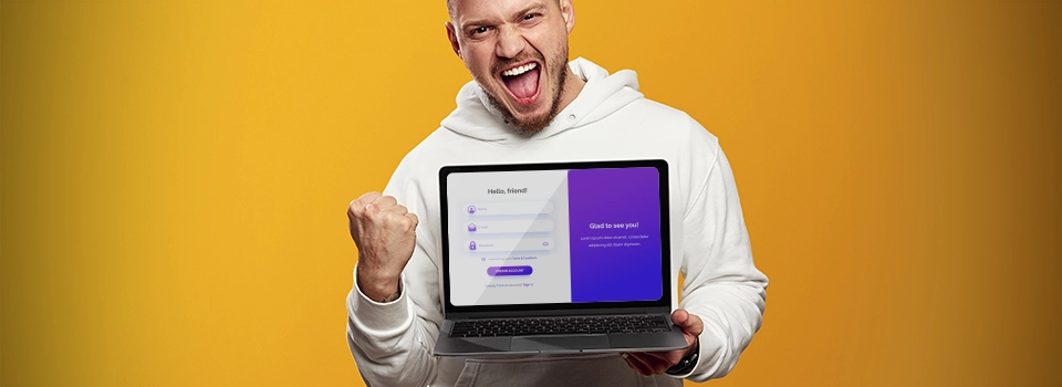 man holding up laptop with sign up form