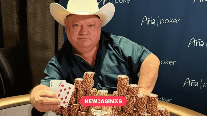 The Snack Attack: Clyde’s Journey from Poker Enthusiast to Casino Icon photo of clyde gaskins, also known as the snack attack, posing with a poker hand of 21 and many towers of casino chips.