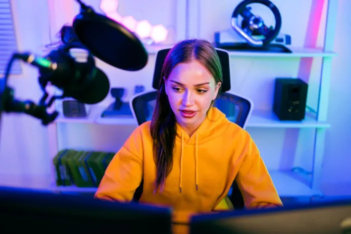 How Do Casino Streamers Make Money? Streamer in a gaming studio with neon lighting, engaging in online content creation