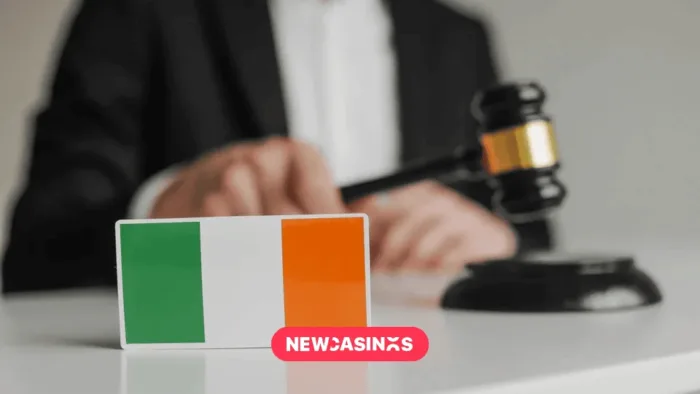 Wooden gavel and Flag of Ireland.