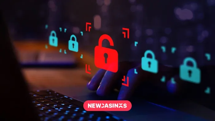 Flutter Investigates Major Data Breach Affecting Paddy Power and Betfair Users A computer keyboard and fingers typing with a red packlock symbol and New Casinos logo overlay.