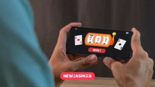UKGC Study Reveals Concerns Over Account Restrictions and Fairness in Online Gambling Hands holding a mobile device playing casino style games.