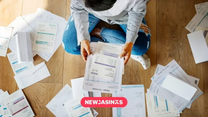 Can Britain Protect Its Betting Heritage Amid Rising Tax Pressures? A birds eye shot of somebody holding papers with others strewn across the floor.