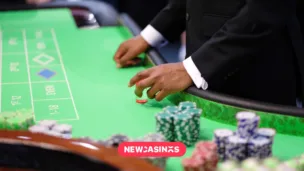 Top 7 Game Developers Who Are Revolutionising Live Casinos in 2025 A poker player's hands placing chips on a felt green table.